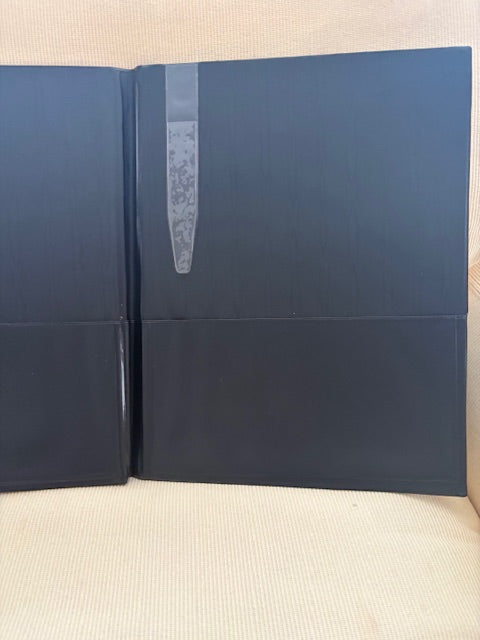 Black binder on a white background