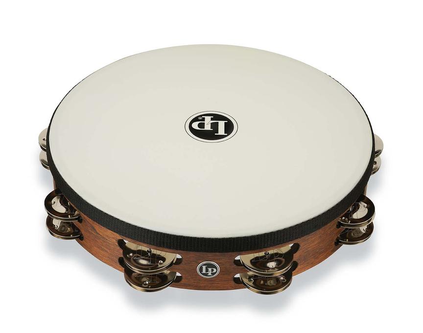 Tambourine with wooden rim and white head on a white background