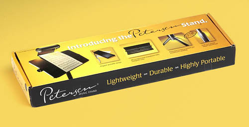 Box packaging for a music stand with yellow and black design on a yellow background